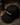 Black cap with 'MEXINK' branding on a dark surface next to a bottle of MEXINK.